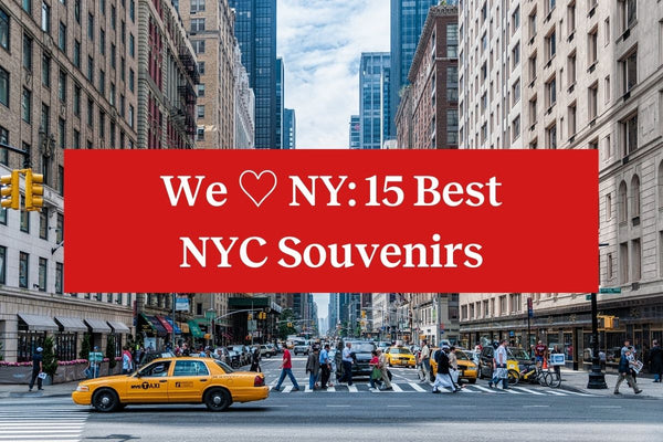 A busy street scene in New York with a yellow taxi and people walking, with a red rectangle and the words "We Heart NY: 15 Best NYC Souvenirs" in white