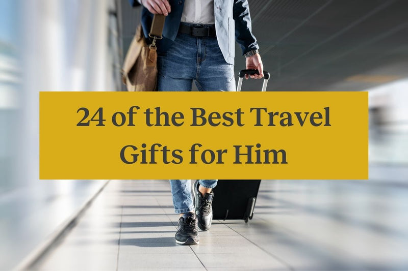 A well-dressed man walking through an airport with a roller suitcase and a yellow rectangle with the words 
