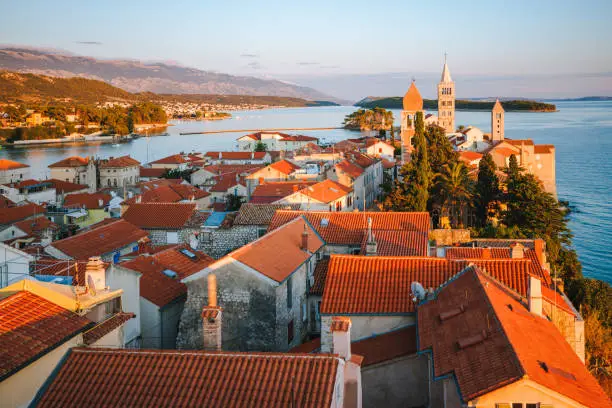 Follow the Croatia Travel Guide To View The Sun Setting Over Terracotta Rooftops and the Adriatic.