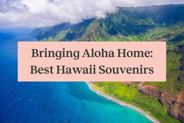 An image of the Hawaiian coastline on a cloudy day, with a pink rectangle that says "Bringing Aloha Home: Best Hawaii Souvenirs"