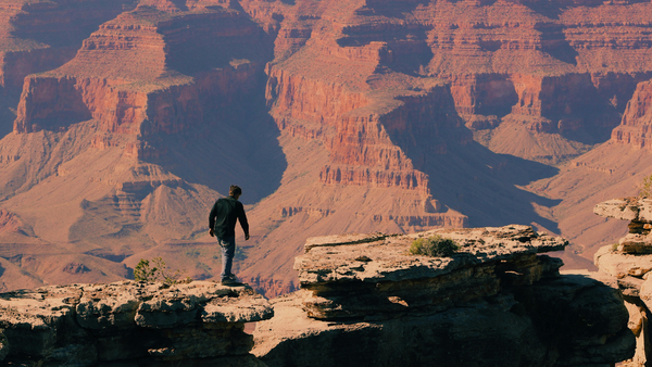 Man Walking At The Grand Canyon