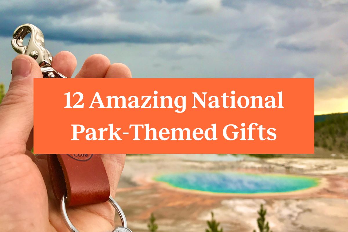 A hand holding a Wanderchain near Grand Prismatic Spring in Yellowstone and an orange rectangle with the words "12 amazing national park themed gifts"