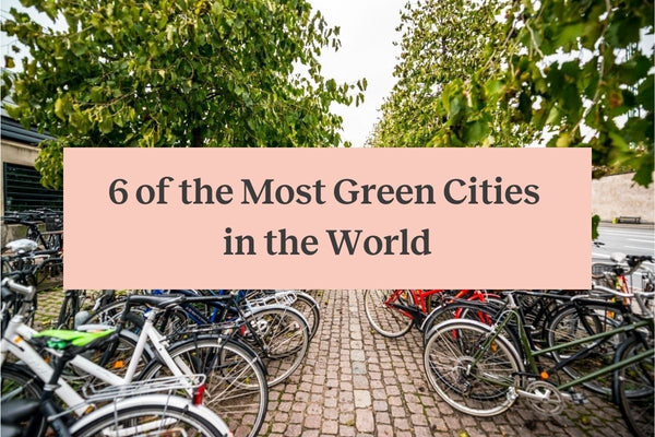 Several bicycles parked in Copenhagen, Denmark, and a pink rectangle with the words "6 of the Most Green Cities in the World"