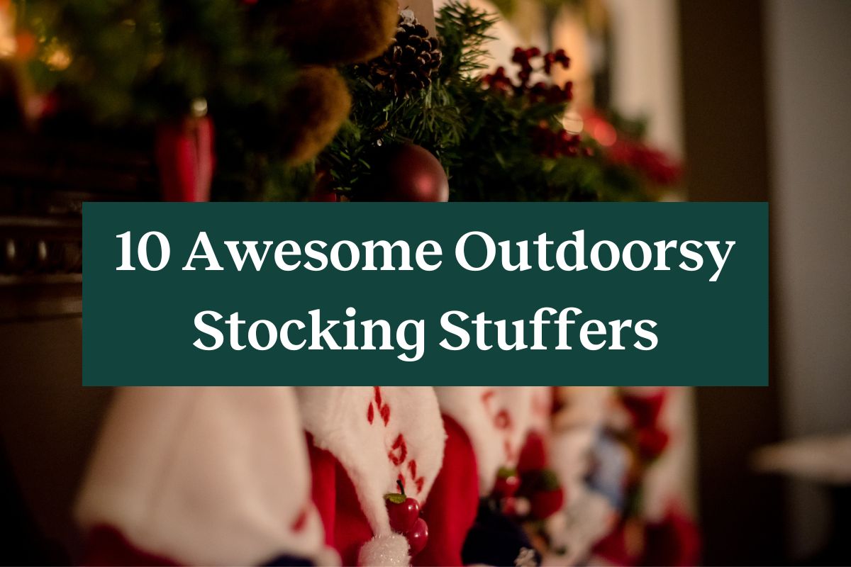 A mantle with several stocking hanging from it and a green rectangle with white letters that read "10 awesome outdoorsy stocking stuffers"